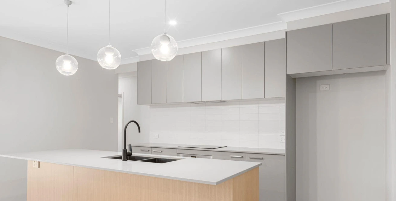 Stylish kitchen at 13 Thyme Street with white cabinetry.