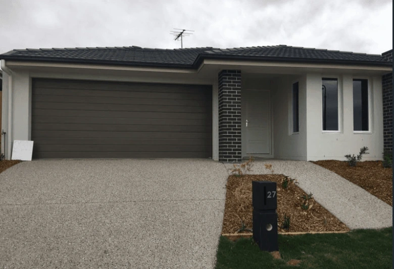 Contemporary facade with double garage on Danbulla Street, South Ripley.