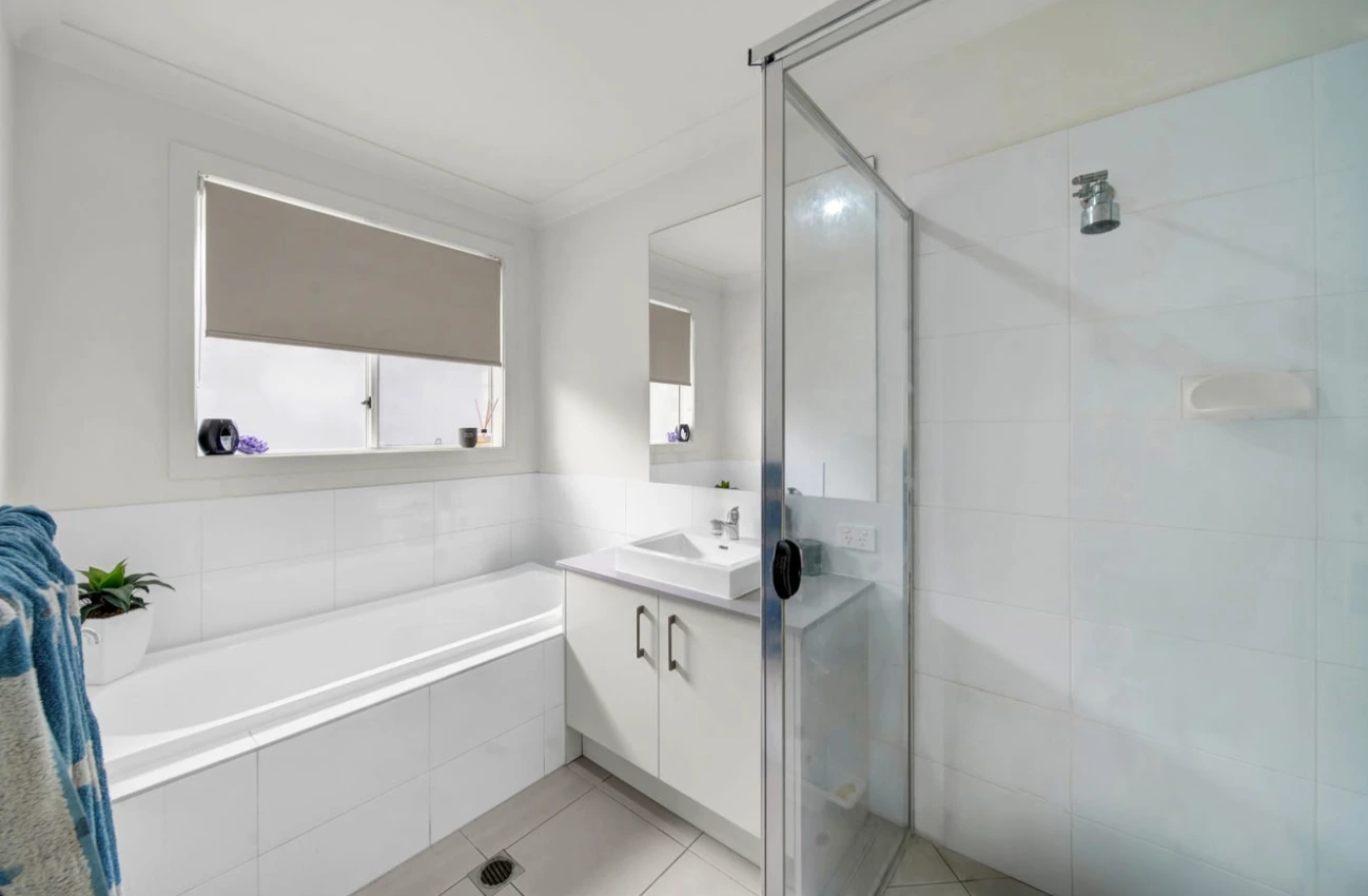 Modern bathroom at 27 Danbulla Street, South Ripley with shower and vanity.