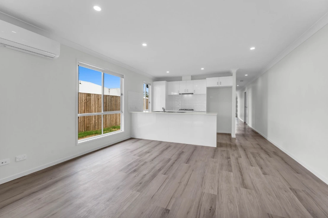 Spacious open-plan living and kitchen in 1/7 Loch Way duplex in Brassall.