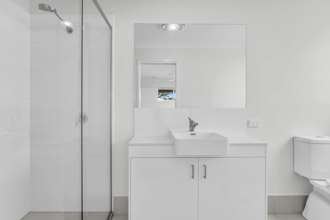 Ensuite bathroom in Brassall duplex at 1/7 Loch Way with vanity and glass shower.