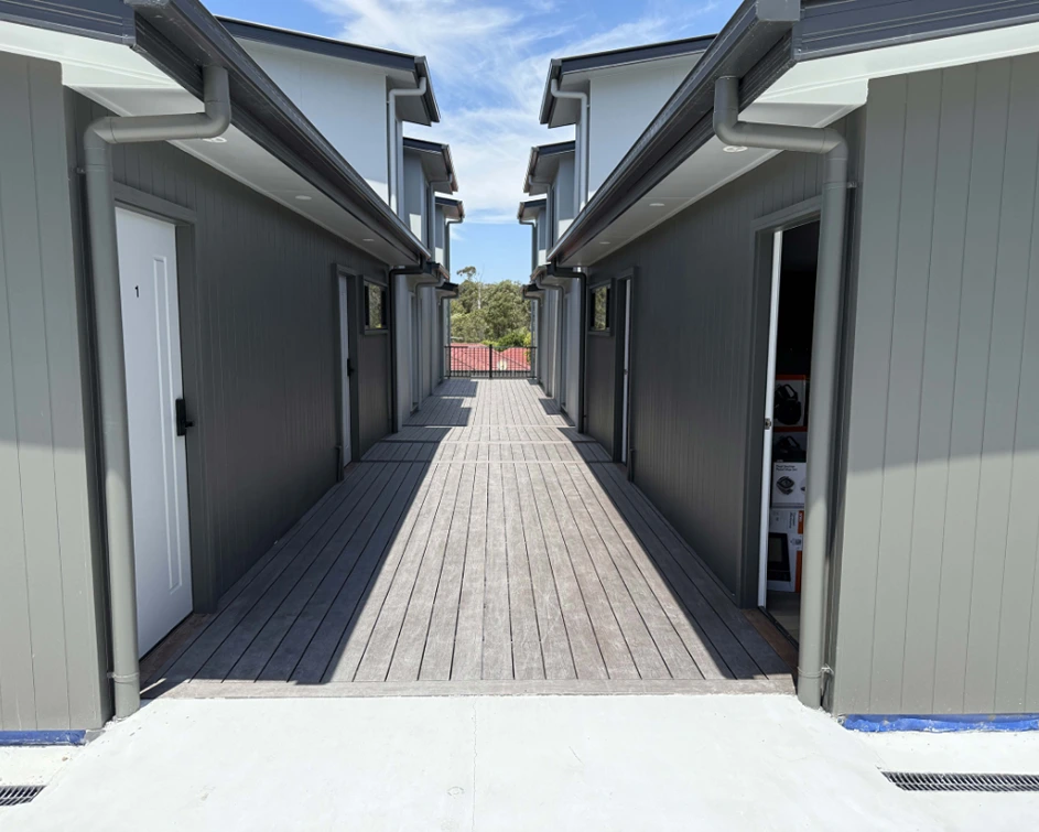 Shared walkway between units at Acacia Ridge complex by You Me and the Community