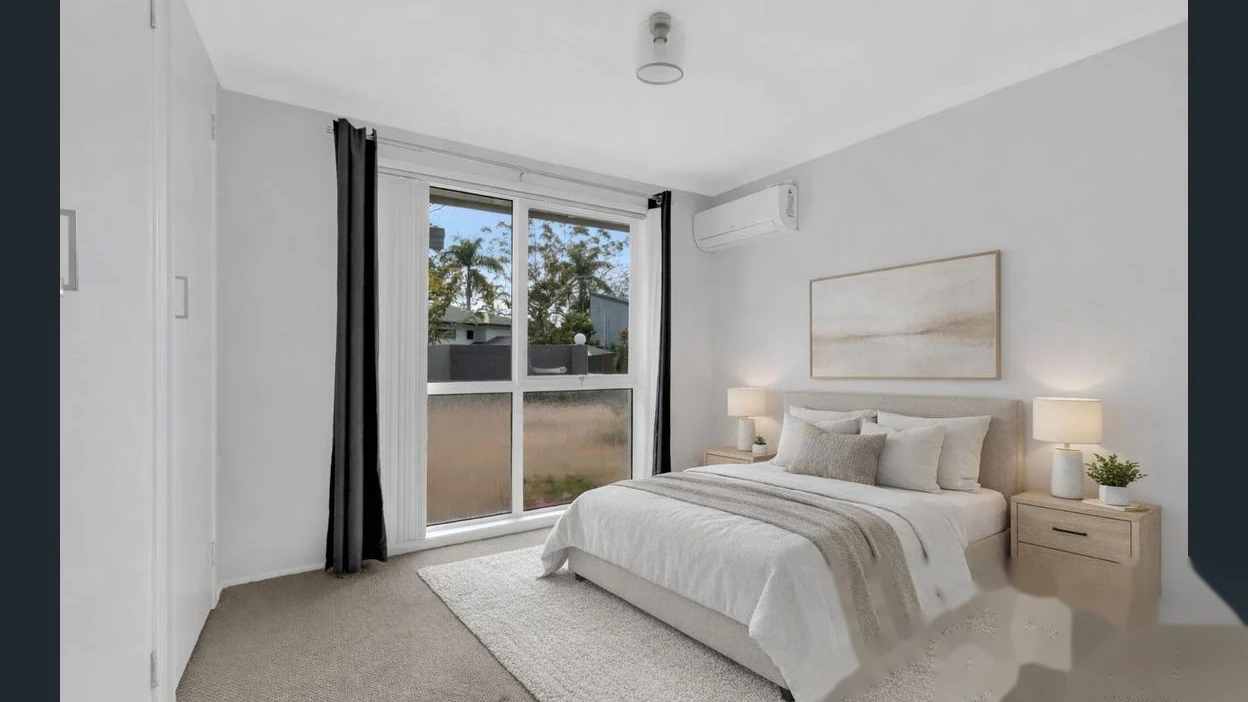 Comfortable bedroom with natural light at 2 Bejimba Street Kenmore by YMC