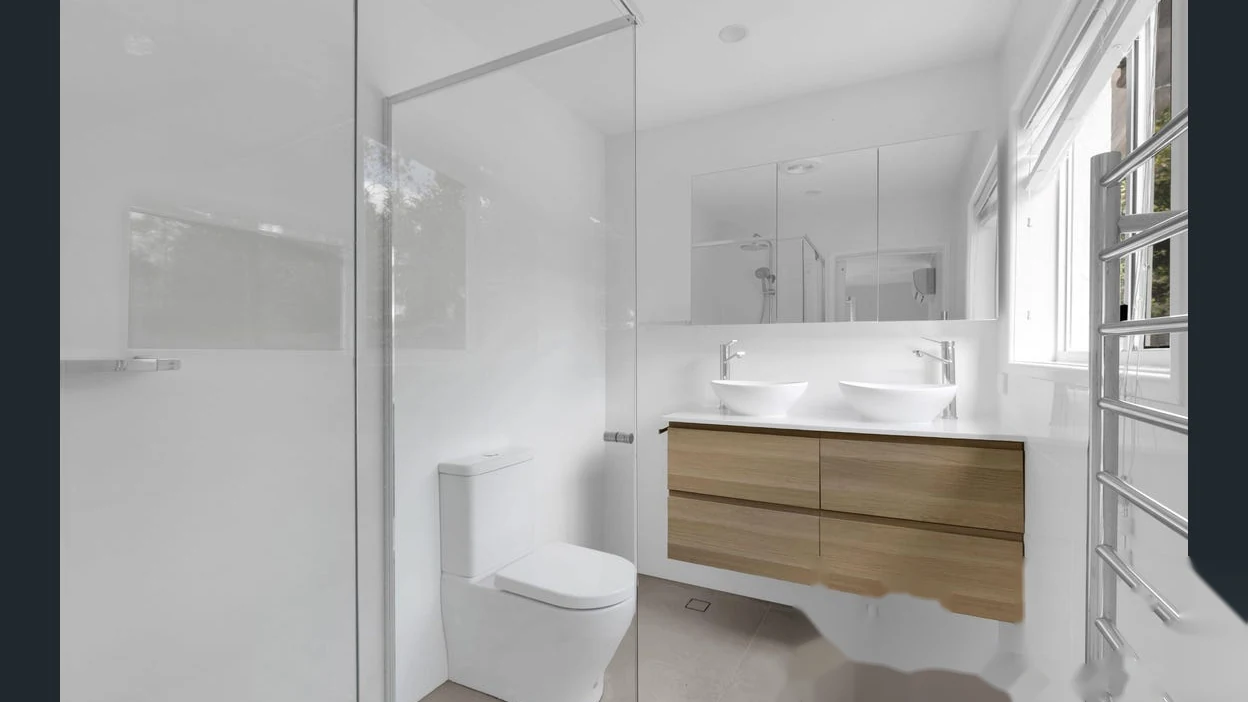 Contemporary bathroom with glass shower and double vanity at 2 Bejimba Street Kenmore by YMC