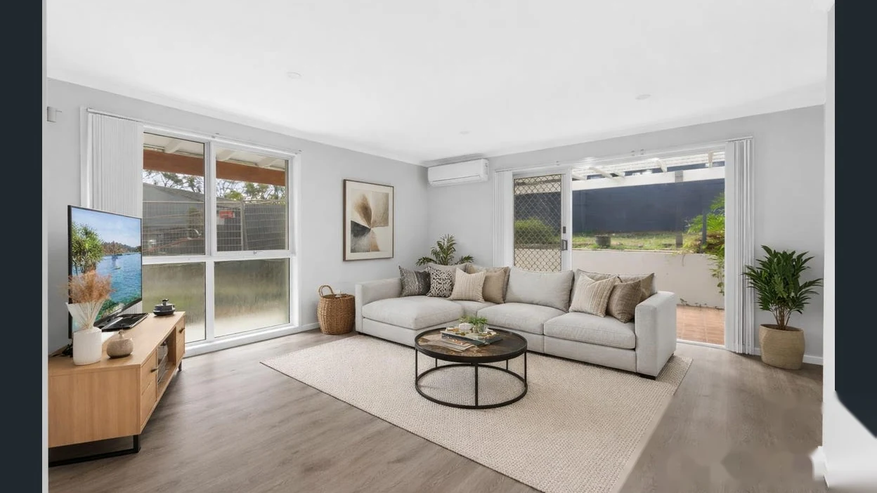 Bright living room with patio access at 2 Bejimba Street Kenmore by YMC