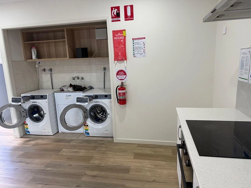 Compact laundry and kitchenette area inside 495 Beatty Road Acacia Ridge accommodation