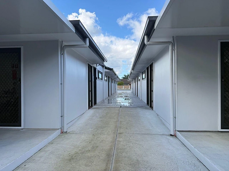 Shared concrete walkway between modern units at 495 Beatty Road Acacia Ridge