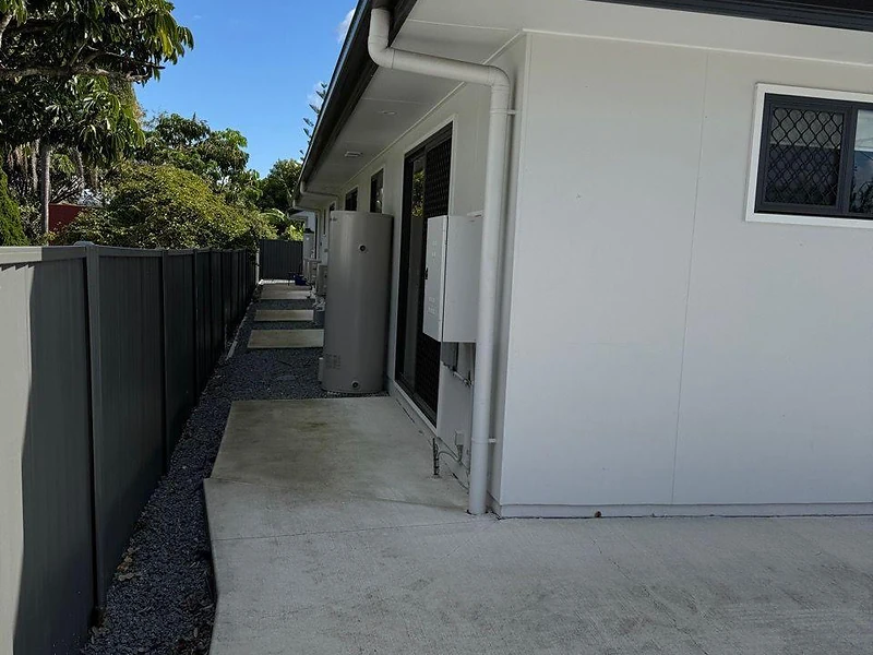 Side access pathway beside modern white unit at 495 Beatty Road Acacia Ridge