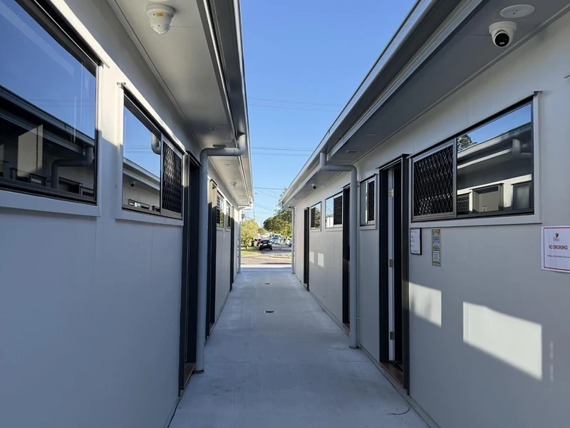 Shared concrete walkway between modern units at 89 Marshall Road Rocklea