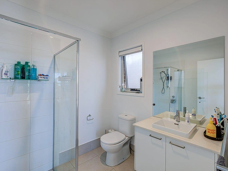 Bathroom with glass shower, toilet and vanity in Greenbank