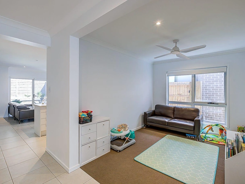 Additional living area with large window and open interior in Greenbank
