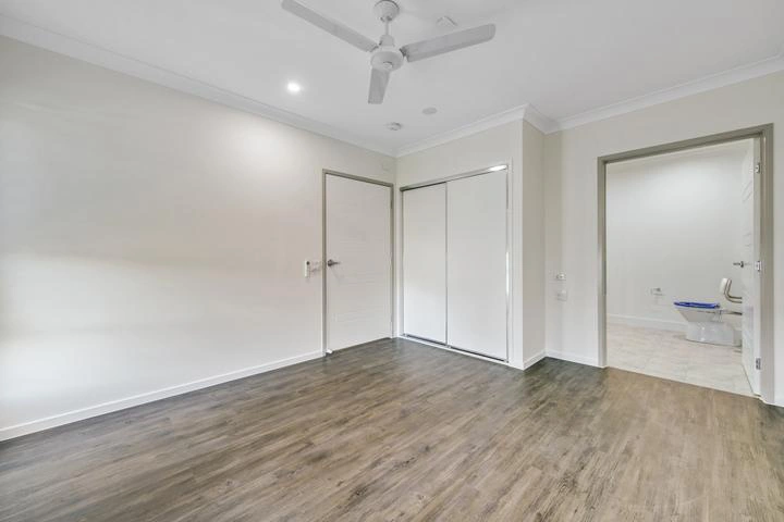 Accessible bedroom with built-in wardrobe and direct ensuite access in Ormeau